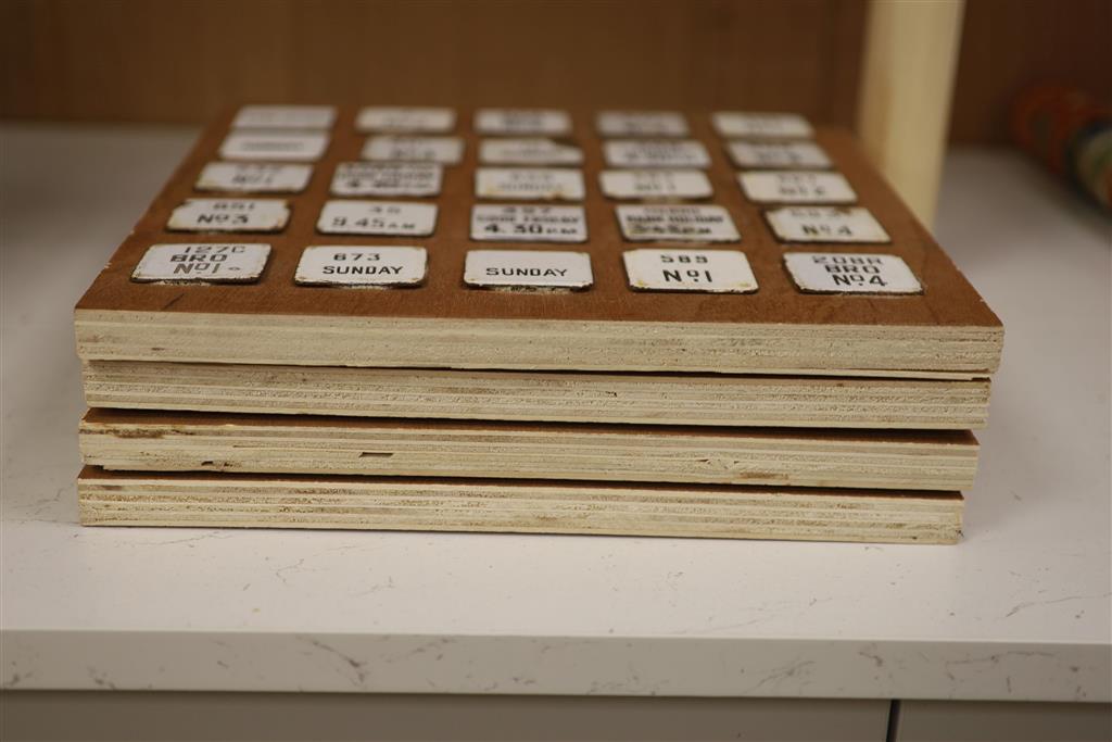 Postal History: A collection of 100 next post enamelled tabs, pre-war, mounted on four wooden display boards